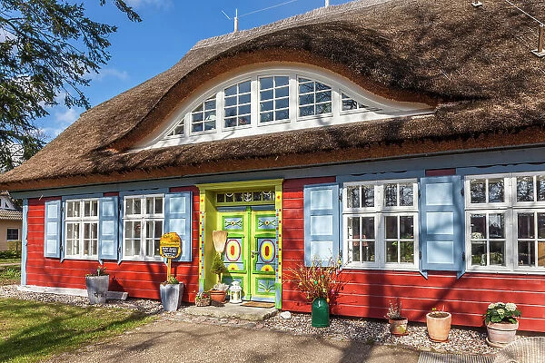 Historic beautifully decorated red thatched cottage in Prerow, Mecklenburg-West Pomerania, Baltic Sea, Northern Germany, Germany