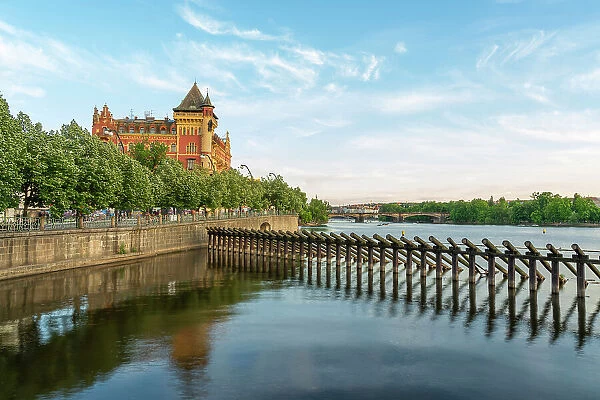 Historic Bellevue building and wooden icebreaker on Vltava river, Prague, Bohemia, Czech Republic
