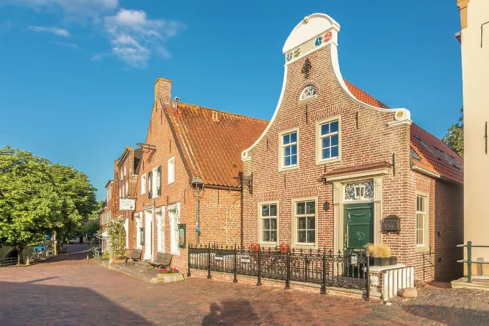 Framed Print : Historic brick houses at the harbor in Greetsiel, East Frisia, Lower Saxony, Germany Framed Print : Historic brick houses at the harbor in Greetsiel, East Frisia, Lower Saxony, Germany