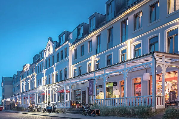 Historic hotels on the western beach of Norderney at blue hour, East Frisian Islands, East Frisia, Lower Saxony, Germany