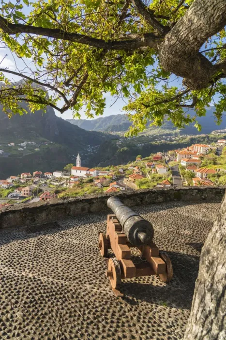 Framed Print : Historical cannon at Faial fortress with the village in the background Framed Print : Historical cannon at Faial fortress with the village in the background