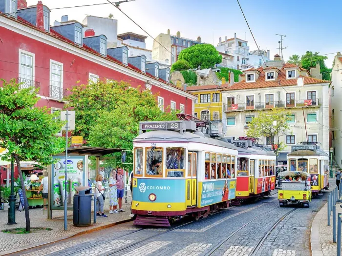 Framed Print : Hist√≥ric Alfama District, Street Scene with yellow Vintage Tram Number 28 Lisbon, Portugal