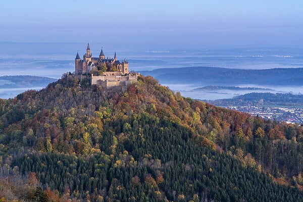Hohenzollern castle in autumnal scenery at dusk. Hechingen, Baden-Wurttemberg, Germany