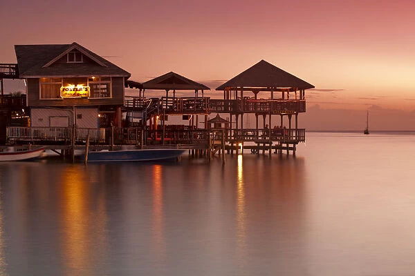 Honduras, Bay Islands, Roatan, West End, Fosters bar and restaurant at sunset