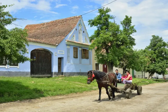 Framed Print : A horse and cart with a family in the Saxon village of Viscri, a Unesco World Heritage Framed Print : A horse and cart with a family in the Saxon village of Viscri, a Unesco World Heritage