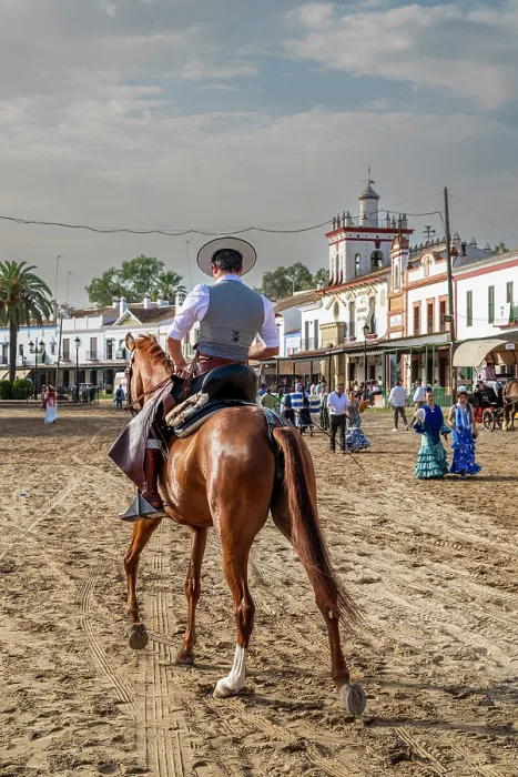 Framed Print : Horseman riding in a street during the Romeria de El Rocio pilgrimage, El Rocio, Huelva, Andalusia, Spain