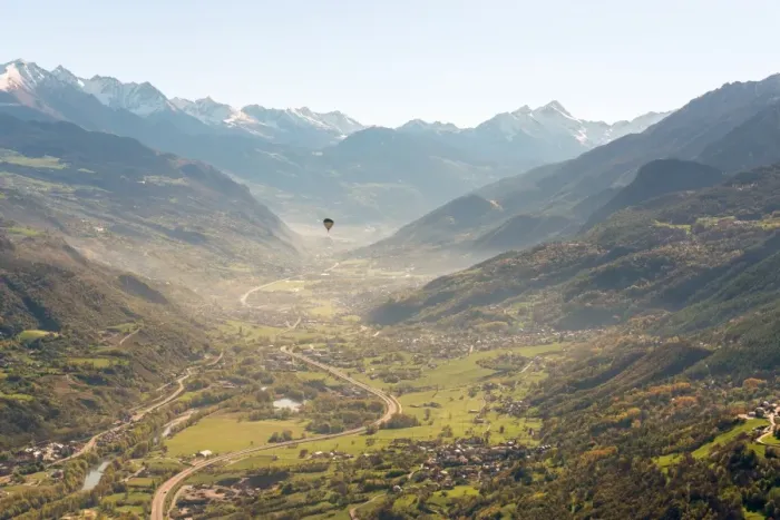 Framed Print : hot air balloon flies over Aosta city, Valle d Aosta, Italy, Europe