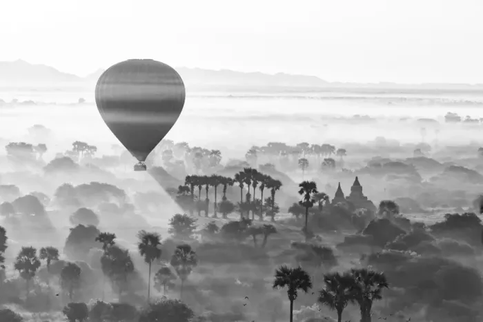 Framed Print : A hot air balloon flies over a trees and a temple at sunrise on a misty morning, Bagan Framed Print : A hot air balloon flies over a trees and a temple at sunrise on a misty morning, Bagan