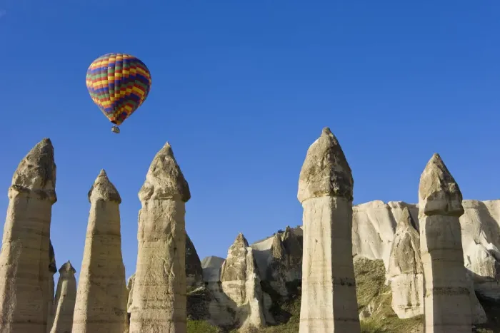Framed Print : Hot Air balloon over the Phallic pillars (Fairy Chimneys), Love Valley, near Goreme Framed Print : Hot Air balloon over the Phallic pillars (Fairy Chimneys), Love Valley, near Goreme