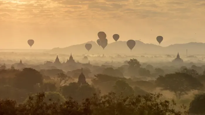Framed Print : Hot air balloons fly over the temples of Bagan at sunrise on a misty morning, Myanmar