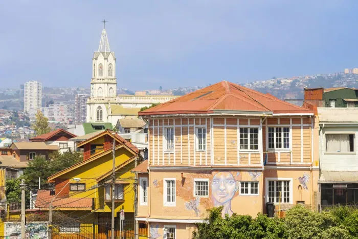 Framed Print : House with painted mural and Parroquia Las Carmelitas church in background, Valparaiso, Valparaiso Province, Valparaiso Region, Chile