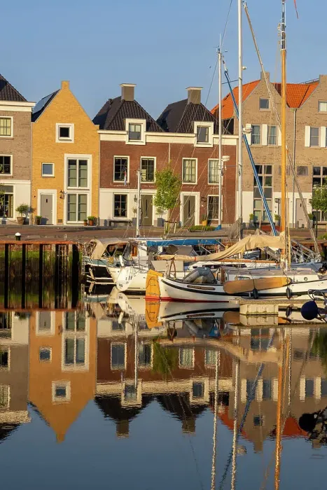 Framed Print : Houses along the old port reflected in the calm water, Harlingen, Friesland, Netherlands