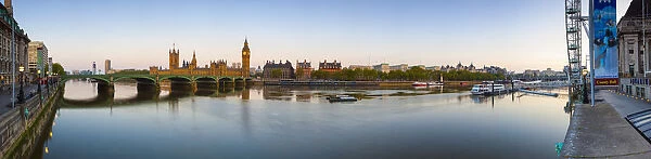 The Houses of Parliament & The River Thames illuminated at dawn