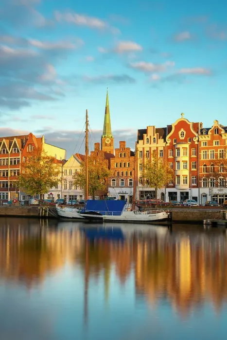 Framed Print : Houses on riverfront of Trave river with tower of St. Jakobi Kirche church in background at sunset, Lubeck, UNESCO, Schleswig-Holstein, Germany Framed Print : Houses on riverfront of Trave river with tower of St. Jakobi Kirche church in background at sunset, Lubeck, UNESCO, Schleswig-Holstein, Germany