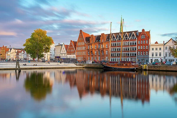 Houses on riverside of Trave river and Wassertreppe (Water steps) at sunset, Lubeck, UNESCO, Schleswig-Holstein, Germany