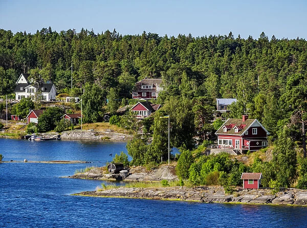 Houses on the shore of the waterway from Stockholm to the Baltic Sea, Stockholm County, Sweden