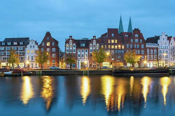 Houses with traditional gables along Trave river at twilight, Lubeck, UNESCO, Schleswig-Holstein, Germany
