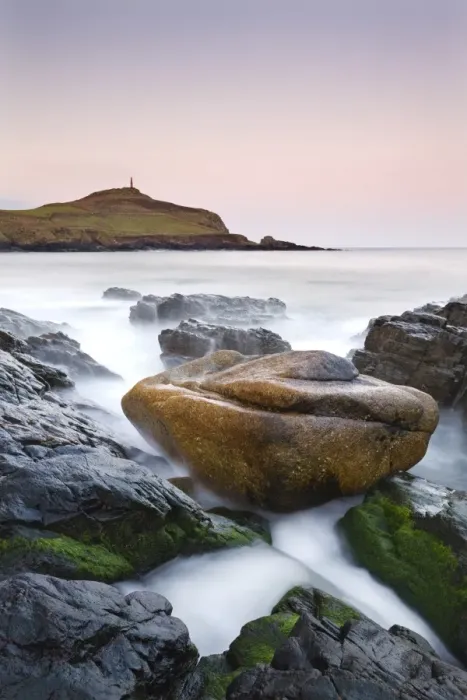 Framed Print : Huge granite boulder lodged on the shores of Porth Ledden at dawn, Cornwall, England Framed Print : Huge granite boulder lodged on the shores of Porth Ledden at dawn, Cornwall, England