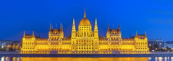 Hungarian Parliament Building & The River Danube illuminated at dusk, Budapest, Hungary