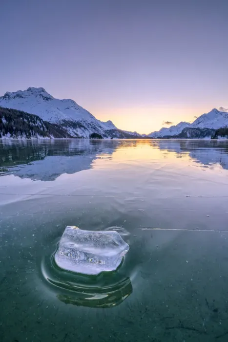 Framed Print : Ice block on frozen water of Lake Sils lit by a cold winter sunset, Graubunden, Engadine