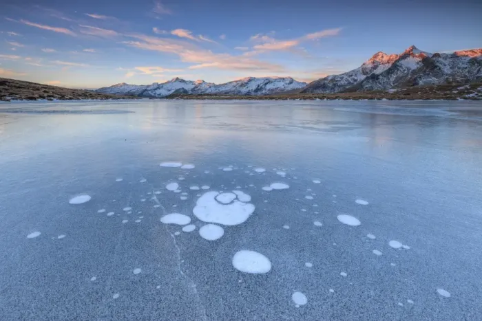 Framed Print : Ice bubbles on the frozen surface of Andossi Lake at sunrise Spluga Valley Valtellina Framed Print : Ice bubbles on the frozen surface of Andossi Lake at sunrise Spluga Valley Valtellina