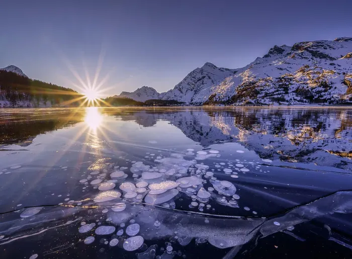 Framed Print : Ice bubbles trapped in the frozen Lake Sils, during a sunsetcanton of Graubunden, Engadine, Switzerland Framed Print : Ice bubbles trapped in the frozen Lake Sils, during a sunsetcanton of Graubunden, Engadine, Switzerland