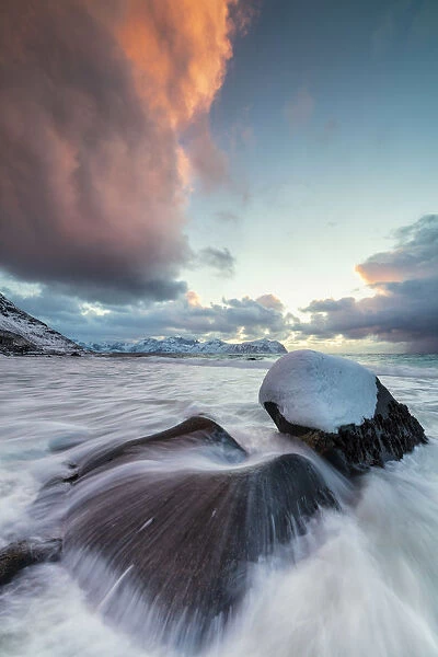 Ice on rocks in the rough sea, Vikten, Flakstad municipality, Lofoten Islands, Norway