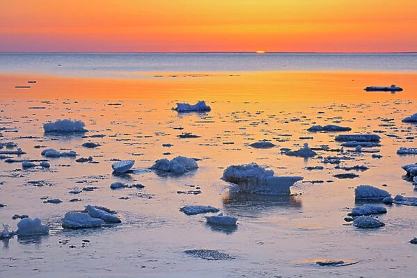 Ice on shore of Lake Winnipeg in spring at sunrise Winnipeg Beach, Manitoba, Canada