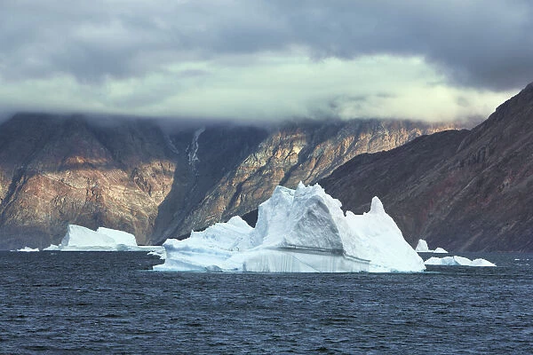 Iceberg and fjord mountains - Greenland, Northeast Greenland National Park, Scoresby Sund