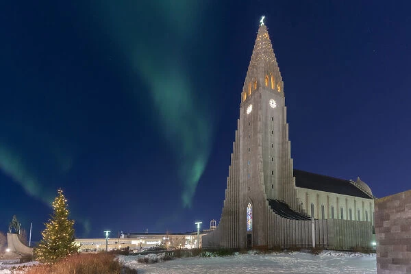 Iceland: Hallgrimskirkja, on the top of Reykjavik under the northern lights