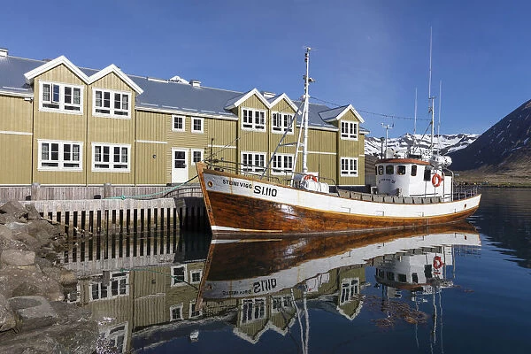 Iceland, Siglufjorður, Siglofjord, Siglo hotel and wooden fishing boat