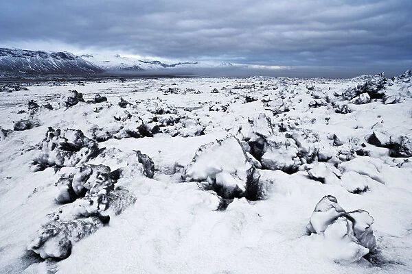 Iceland, Snaefellsnes, Fresh snow on the lava field during a cold morning