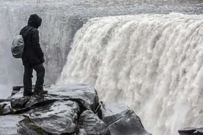 Framed Print : Iceland, a tourist admiring the power of Dettifoss waterfall Framed Print : Iceland, a tourist admiring the power of Dettifoss waterfall