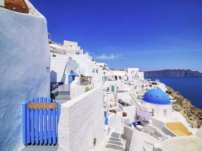 Framed Print : Iconic blue domed church of Saint Spyridon, Oia Village, Santorini or Thira Island, Cyclades, Greece