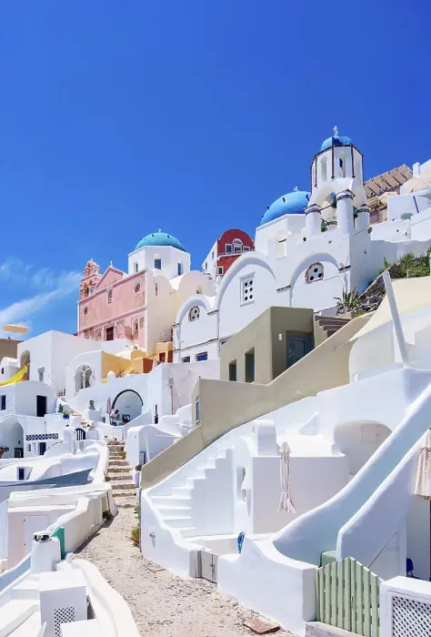 Framed Print : Iconic blue domed churches of Saint Spyridon and Resurrection of the Lord, low angle view, Oia Village, Santorini or Thira Island, Cyclades, Greece