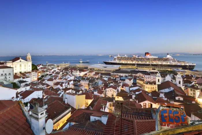 Framed Print : The iconic cruise ship Queen Mary II on the Tagus river facing the traditional moorish