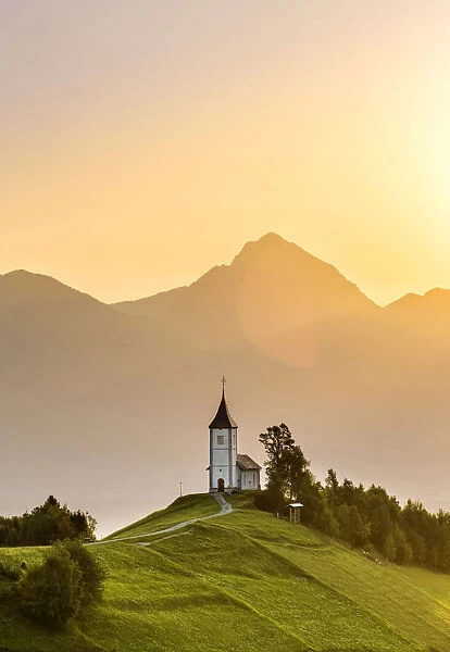 The iconic Jamik church, with Mount Triglav on the background