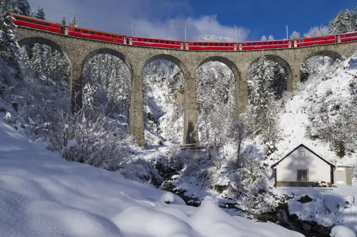 Framed Print : Iconic swiss red Bernina Express train in winter landscape and pristine snow. Swizerland