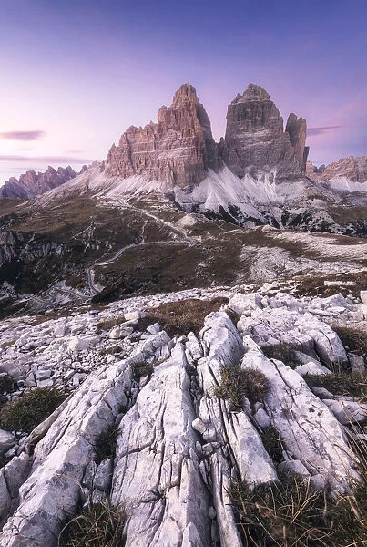 The iconic Tre Cime di Lavaredo during a clear autumn sunset. Dolomites, Italy