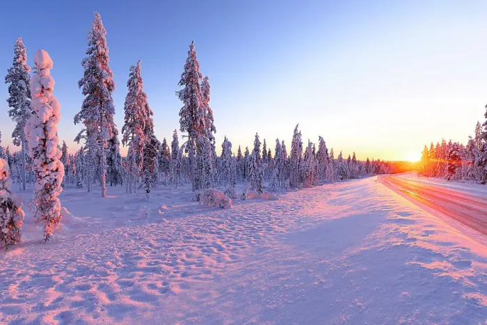 Framed Print : Icy road in the snowy forest brightly lit by the ethereal warm lights of the arctic sunset, Iso Syote, Lapland, Finland Framed Print : Icy road in the snowy forest brightly lit by the ethereal warm lights of the arctic sunset, Iso Syote, Lapland, Finland