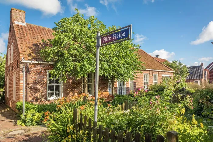Framed Print : Idyllic cottage garden in the village of Pilsum, Krummhoern, East Frisia, Lower Saxony, Germany