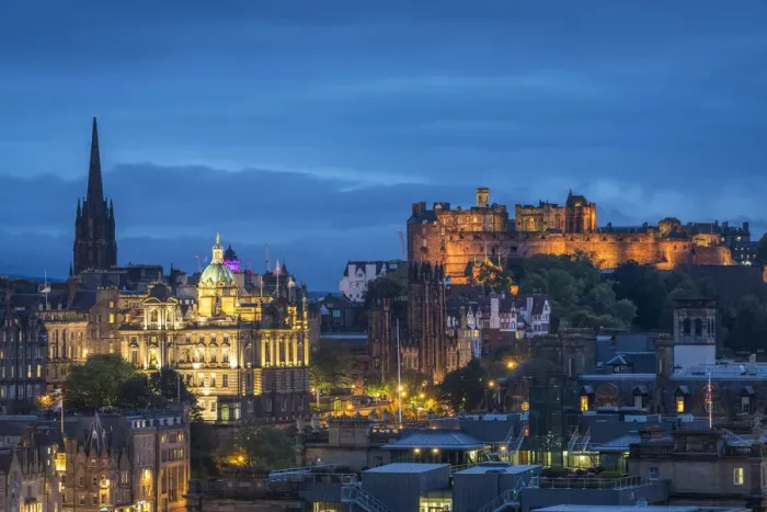 Framed Print : Illuminated Edinburgh Castle against blue sky at dusk viewed from Observatory House