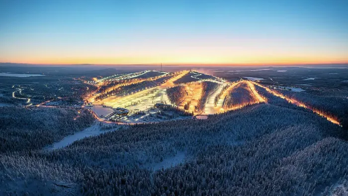 Framed Print : Illuminated snowy ski slopes of Ruka ski resort surrounded by frozen forests at dusk, Lapland, Finland Framed Print : Illuminated snowy ski slopes of Ruka ski resort surrounded by frozen forests at dusk, Lapland, Finland