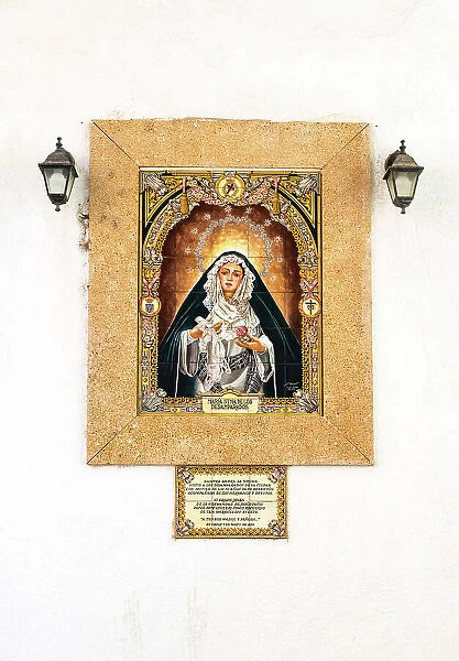 Image of Maria Santisima de los Desamparados (Virgin of the Helpless) on a building facade in Cadiz, Andalusia, Spain