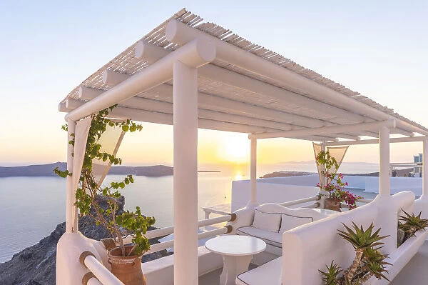 Imerovigli, Santorini, Cyclade Islands, Greece. Balcony patio at sunset