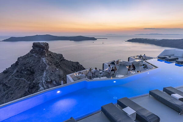 Imerovigli, Santorini, Cyclade Islands, Greece. Infinity pool at sunset