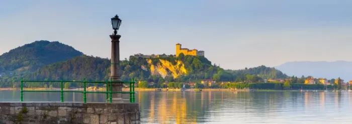 Framed Print : The imposing La Rocca fortress viewd from Arona at sunset, Lake Maggiore, Piedmont, Italy