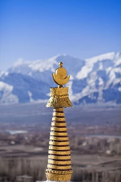 India, Ladakh, Thiksey. The golden finial of a chorten at Thiksey Monastery
