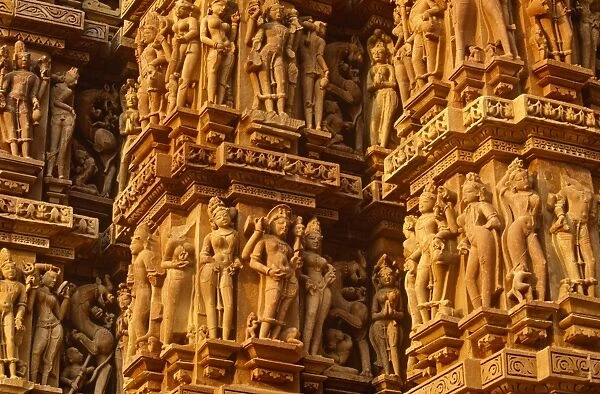 India, Madhya Pradesh, Khajuraho. The Kandariya Mahadeva Temple at Khajuraho is one of several celebrated Hindu temples famed their exuberant sculpture. Khajurahos temples are now a UNESCO World