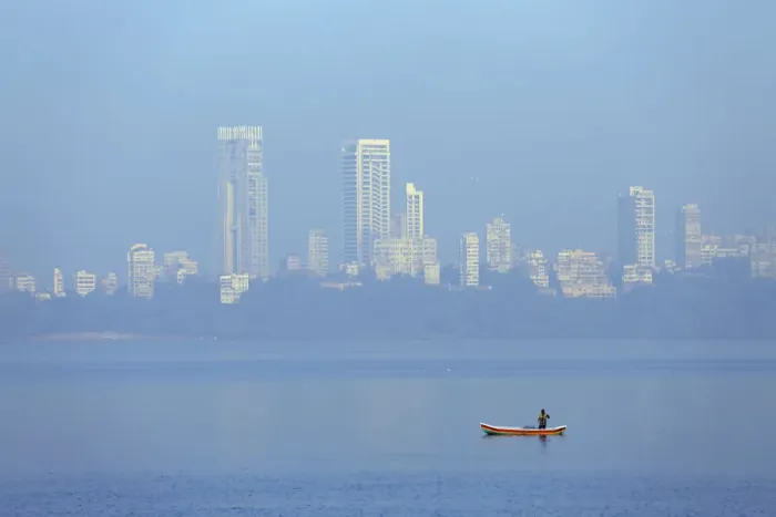 Framed Print : India, Maharashtra, Mumbai, a fisherman in a traditional boat fishing off Nariman Point Framed Print : India, Maharashtra, Mumbai, a fisherman in a traditional boat fishing off Nariman Point
